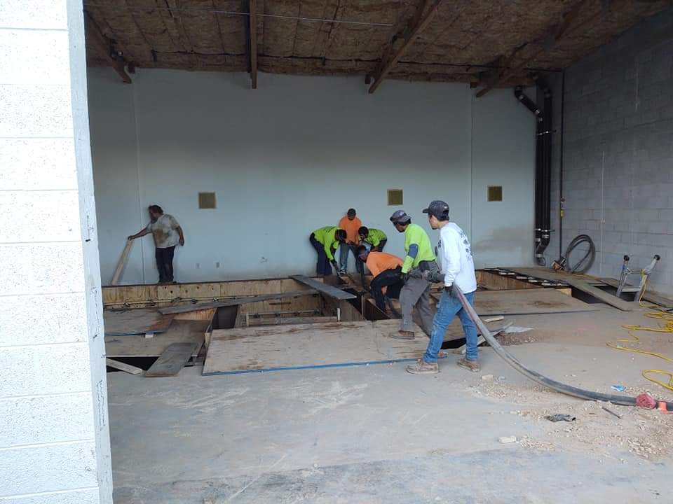 Interior floor forms being filled during a commercial pour