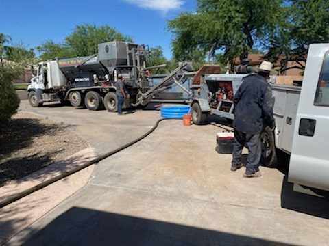 Concrete pump truck at a residential driveway